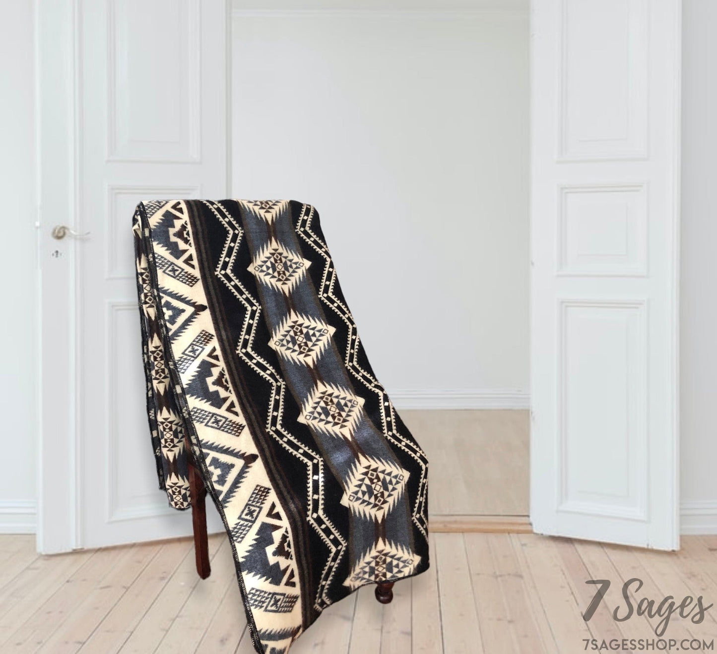 Alpaca Wool Blanket draped over a chair in a white home with wooden floors