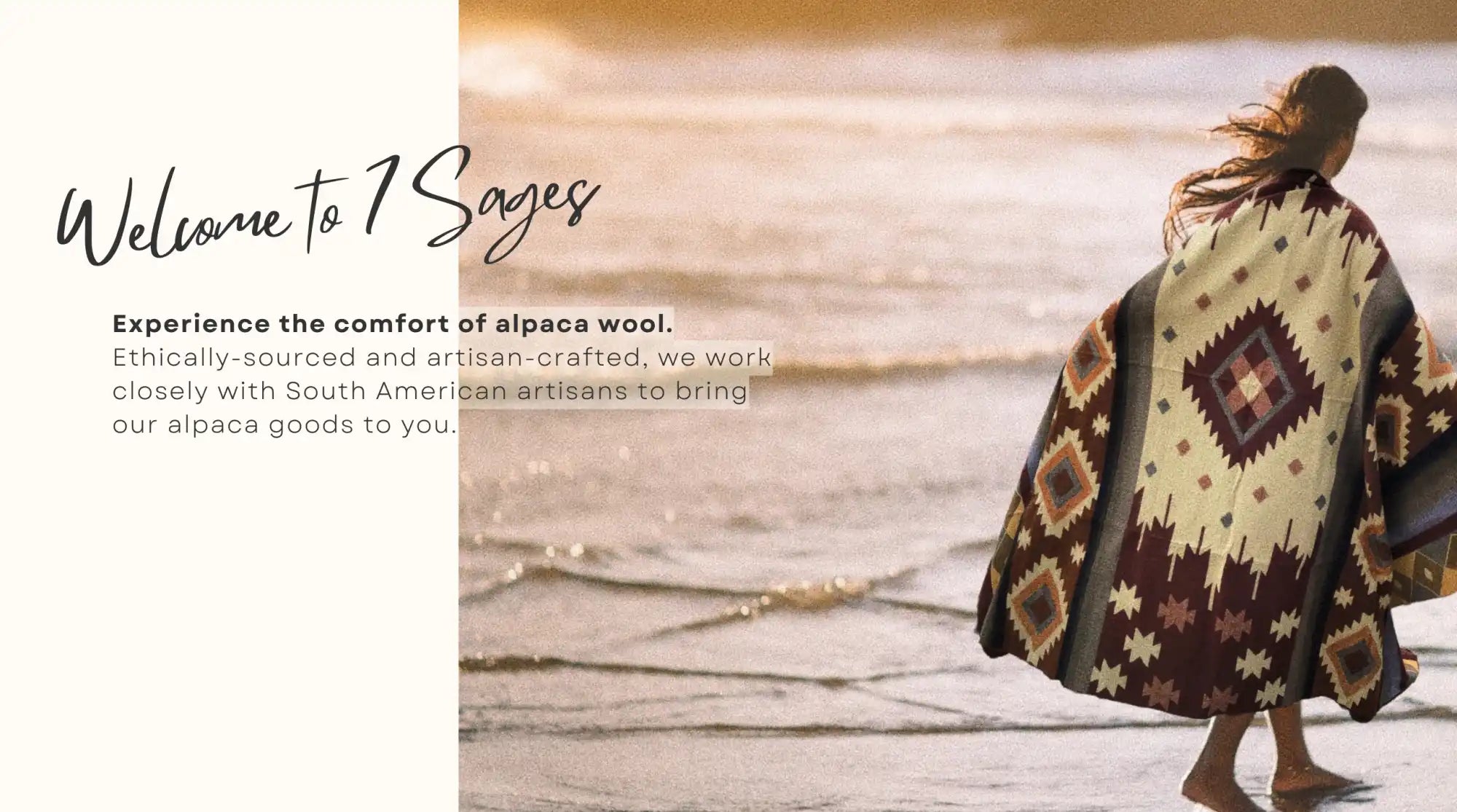 Woman wearing a patterned alpaca wool poncho on a beach.
