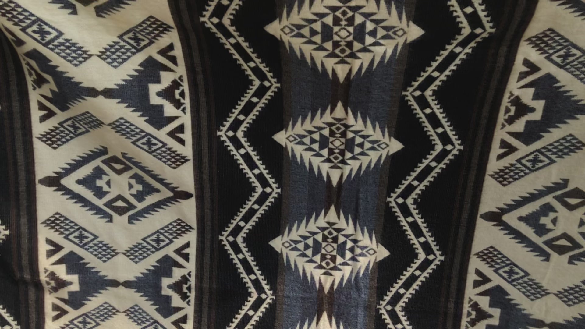 Alpaca wool blanket video showing both sides of reversible blanket